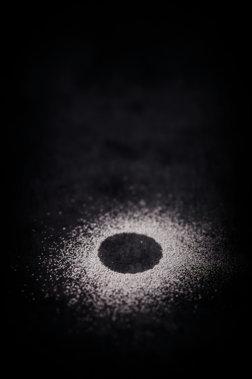 a black and white photo of a round object