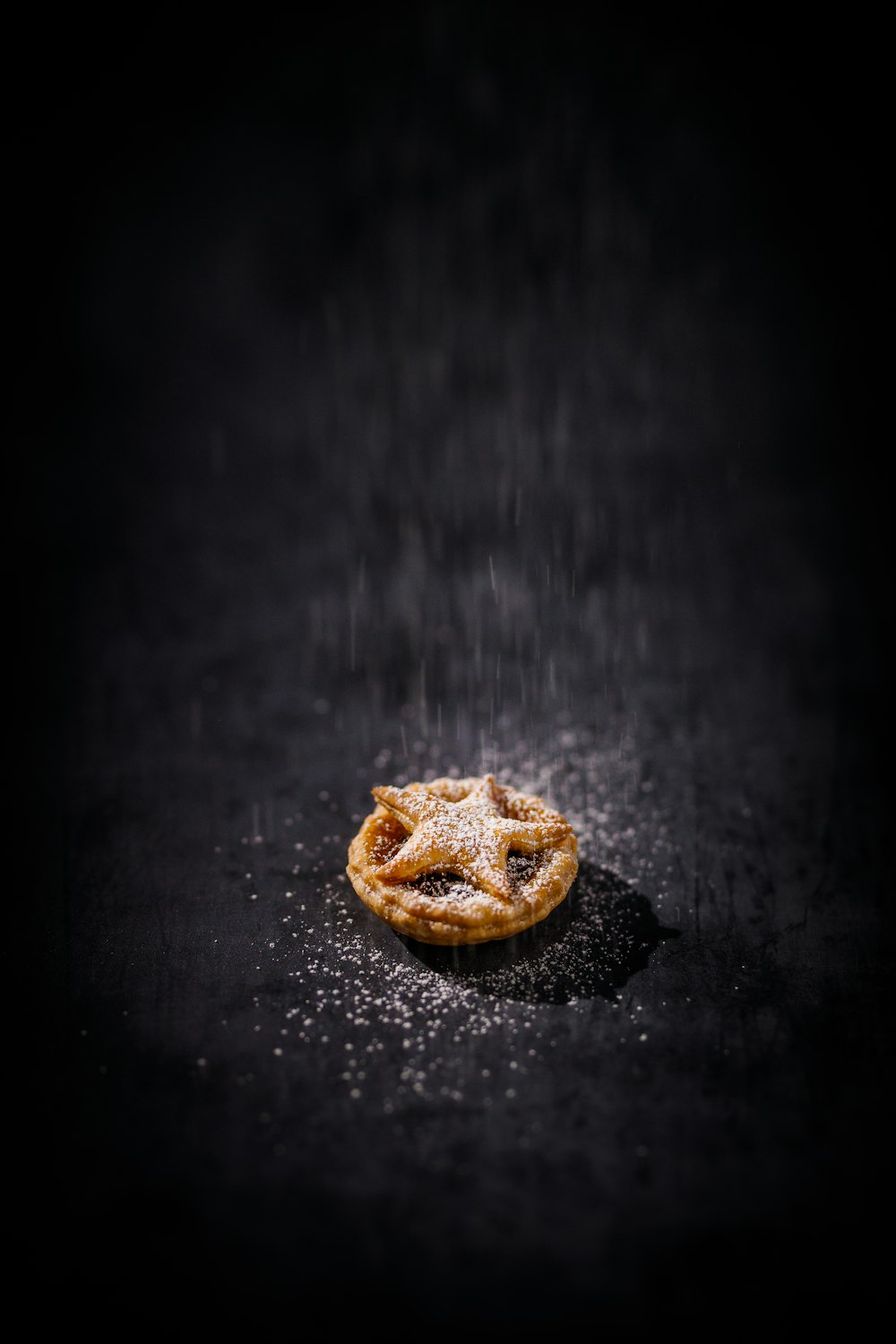 a small pastry sitting on top of a black table