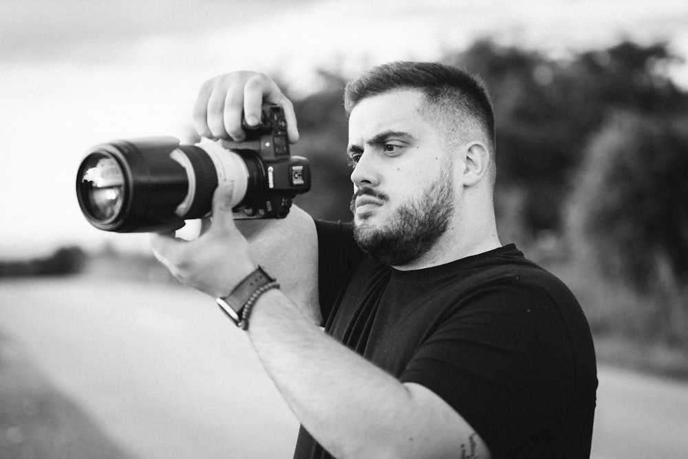 a man taking a picture with a camera