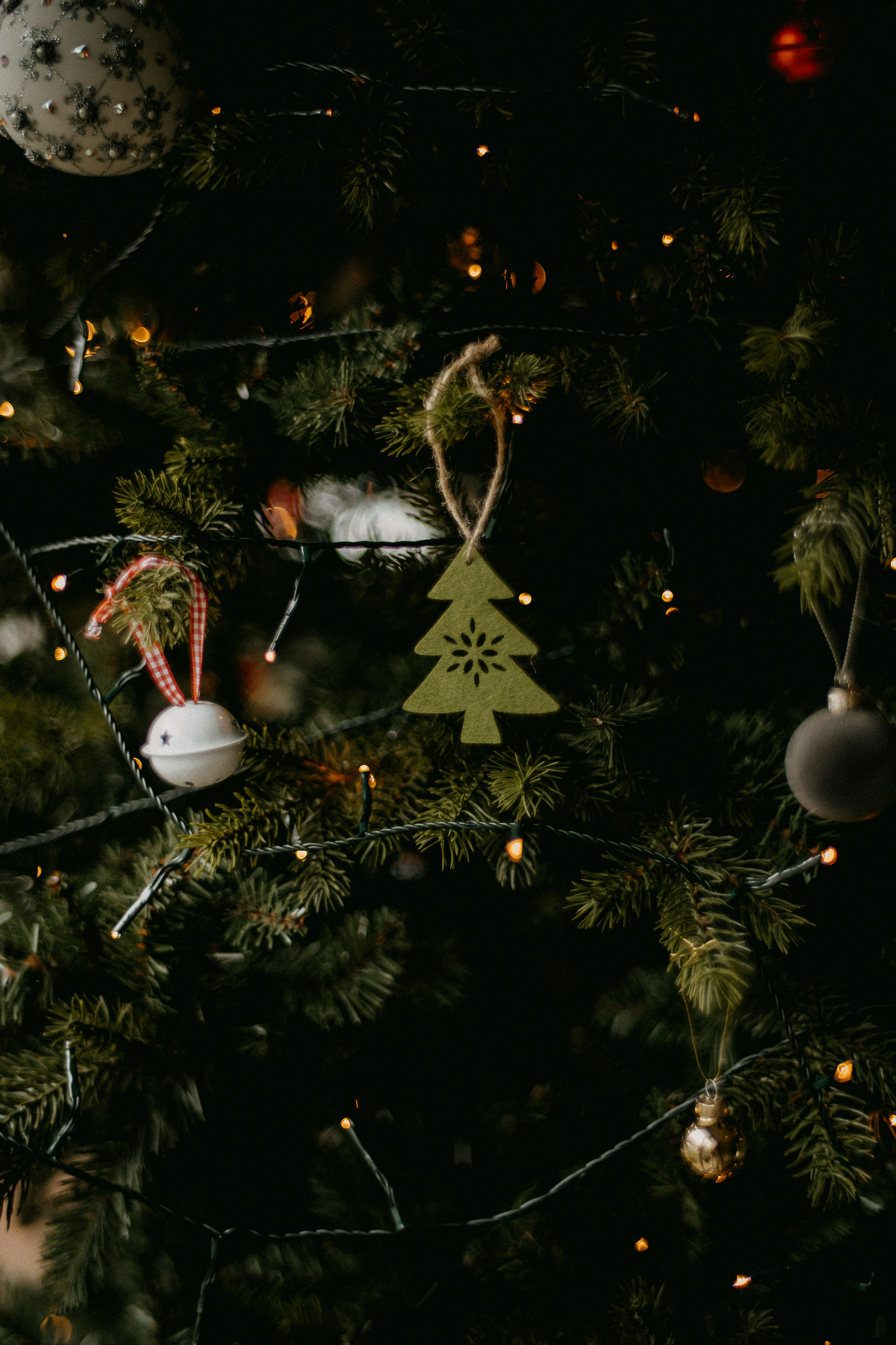 a close up of a christmas tree with ornaments