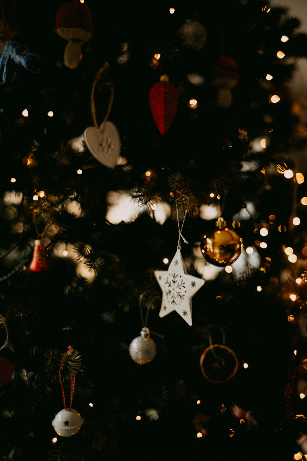 a christmas tree with ornaments hanging from it