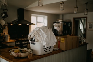 a laundry basket sitting on top of a wooden counter