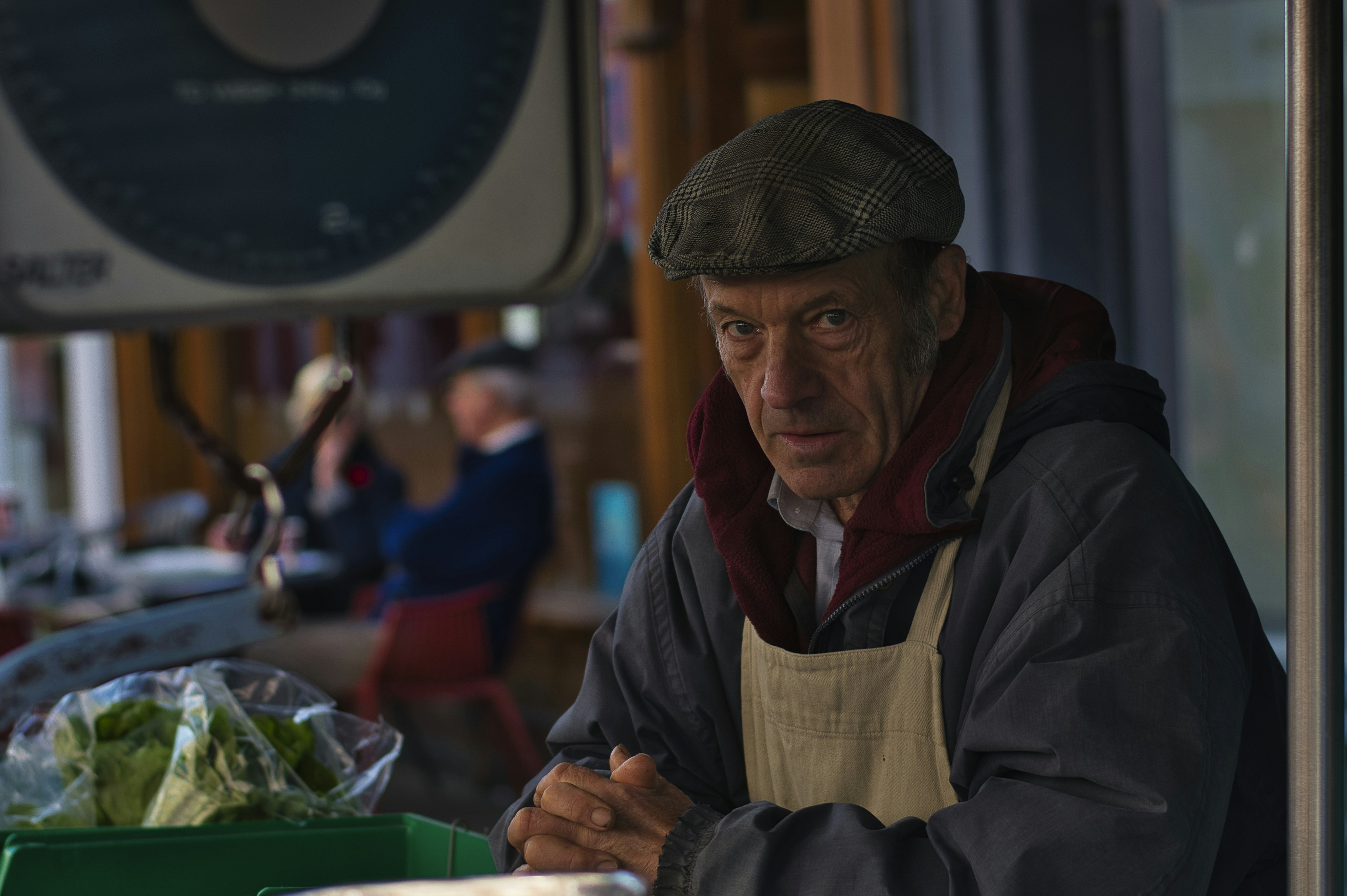 a man sitting at a table with a bowl of food