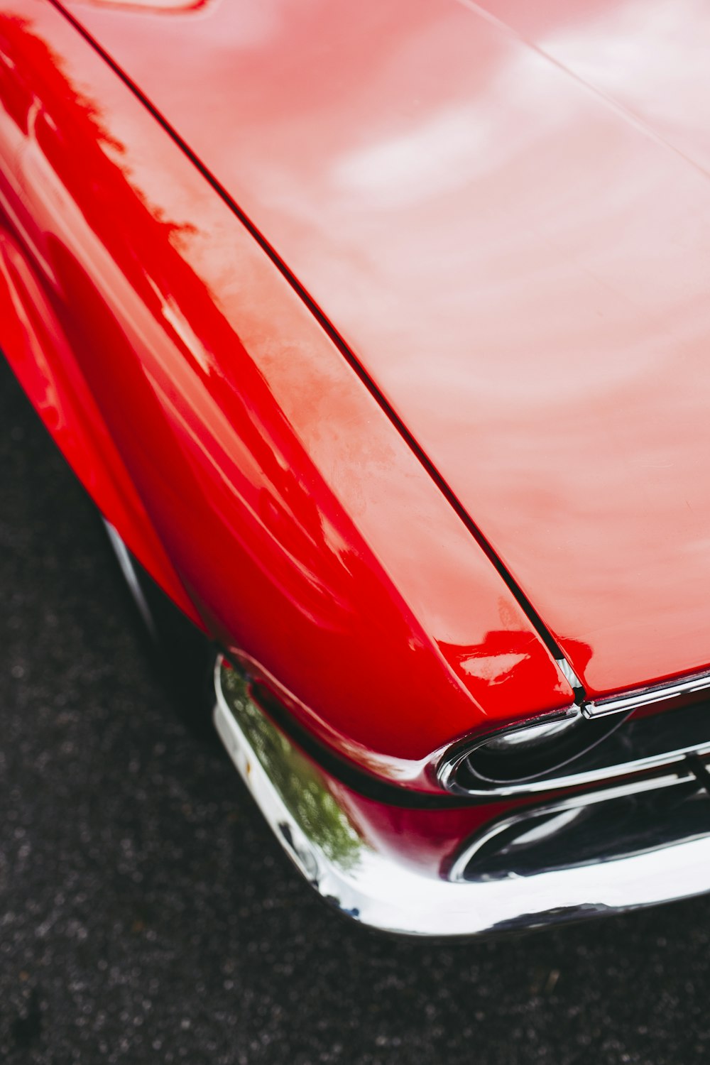 a close up of the front of a red car