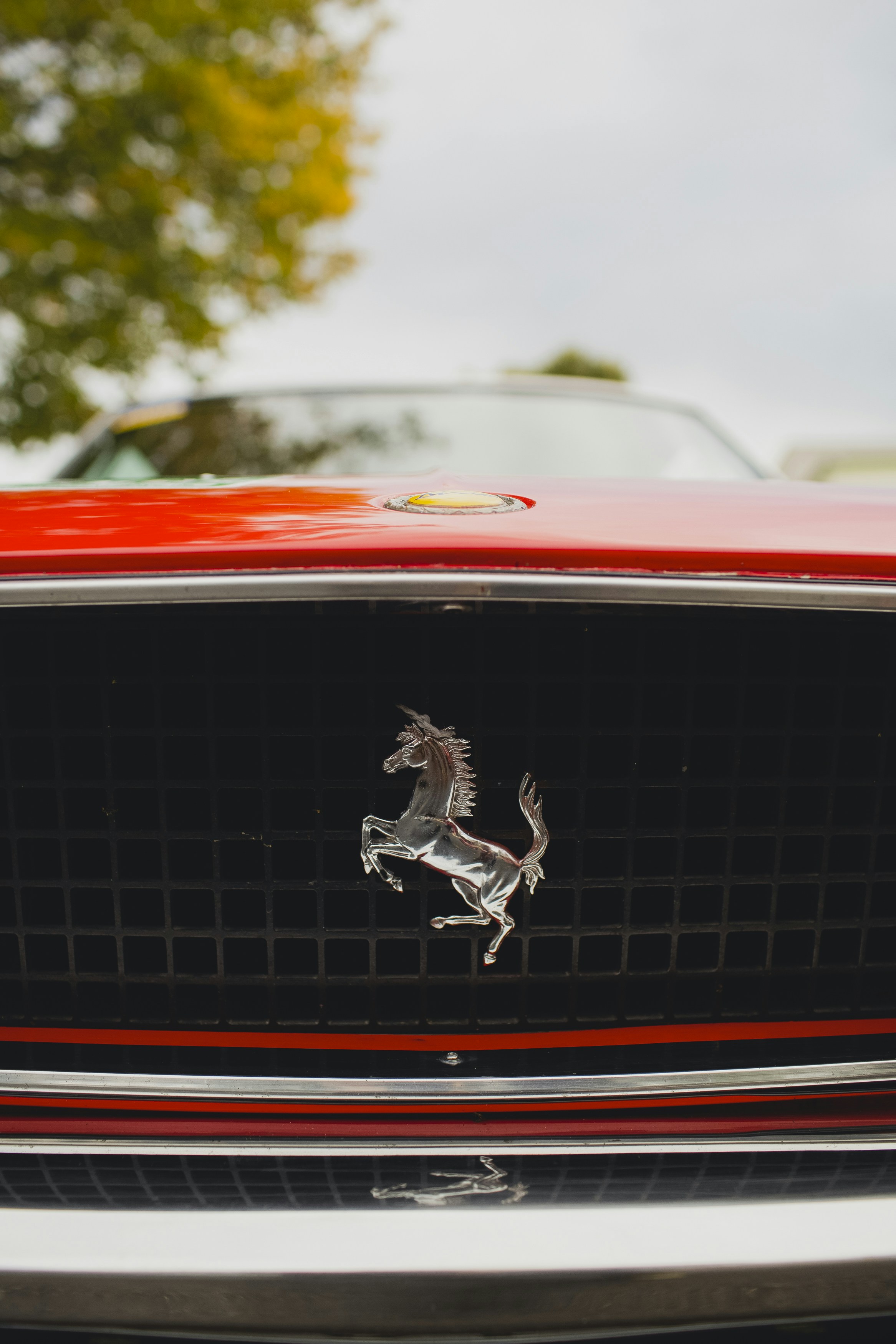 a close up of the front of a red car