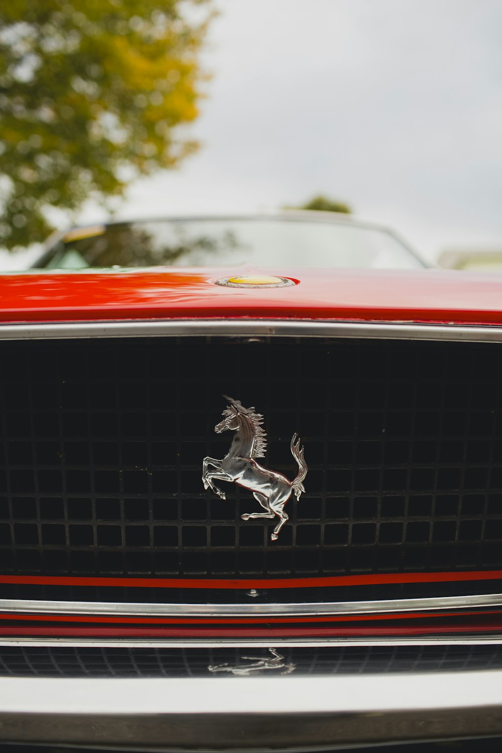 a close up of the front of a red car