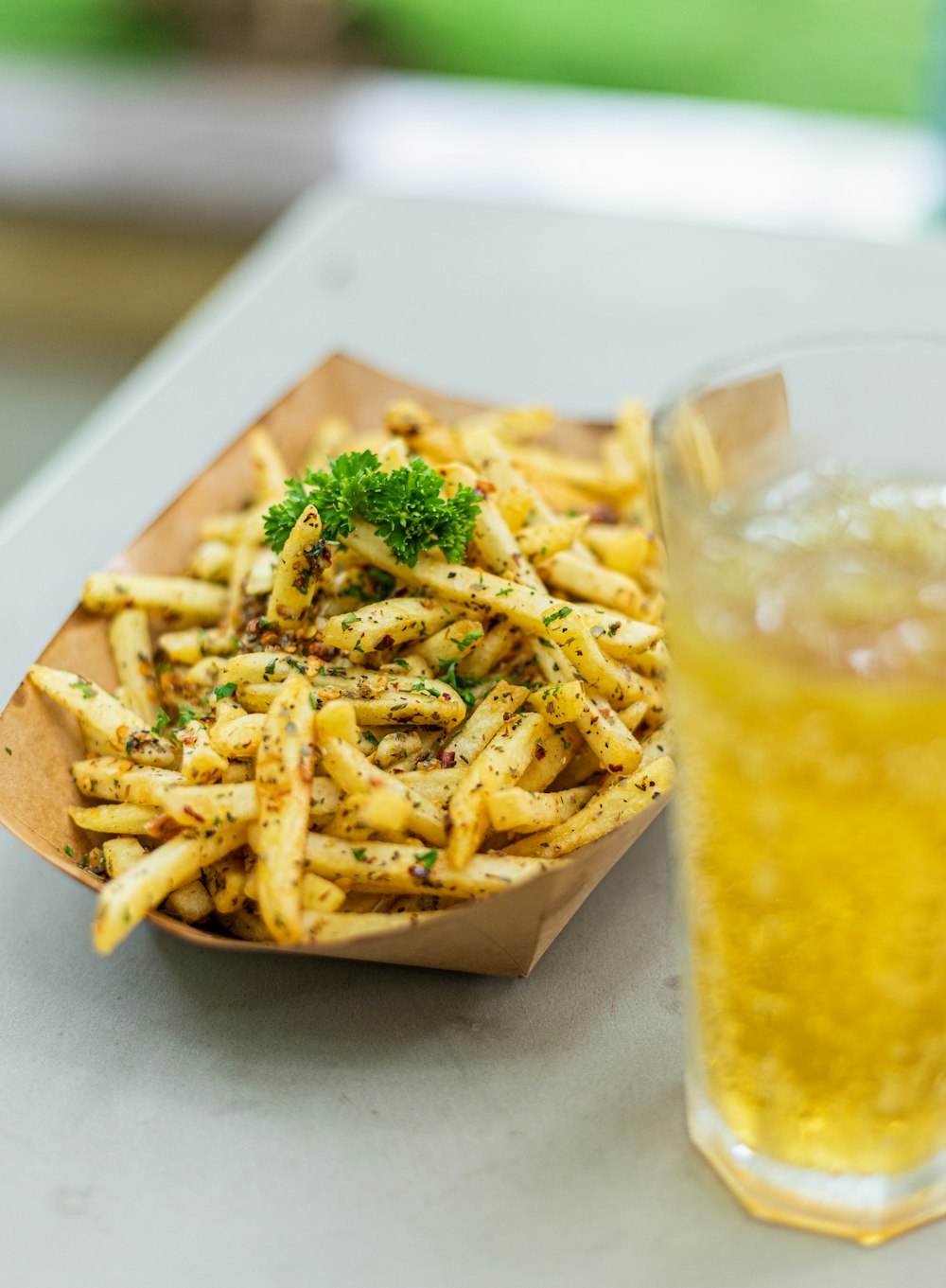 a plate of fries and a glass of beer