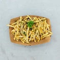 a plate of french fries with a garnish on top