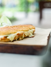 a close up of a sandwich on a cutting board