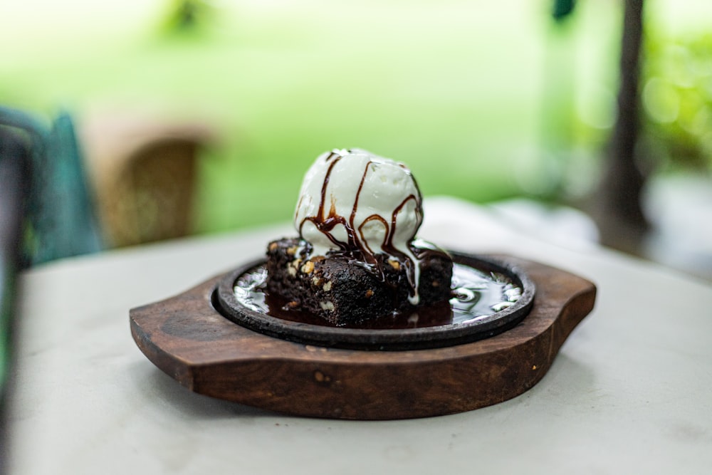 a chocolate dessert with ice cream and chocolate sauce