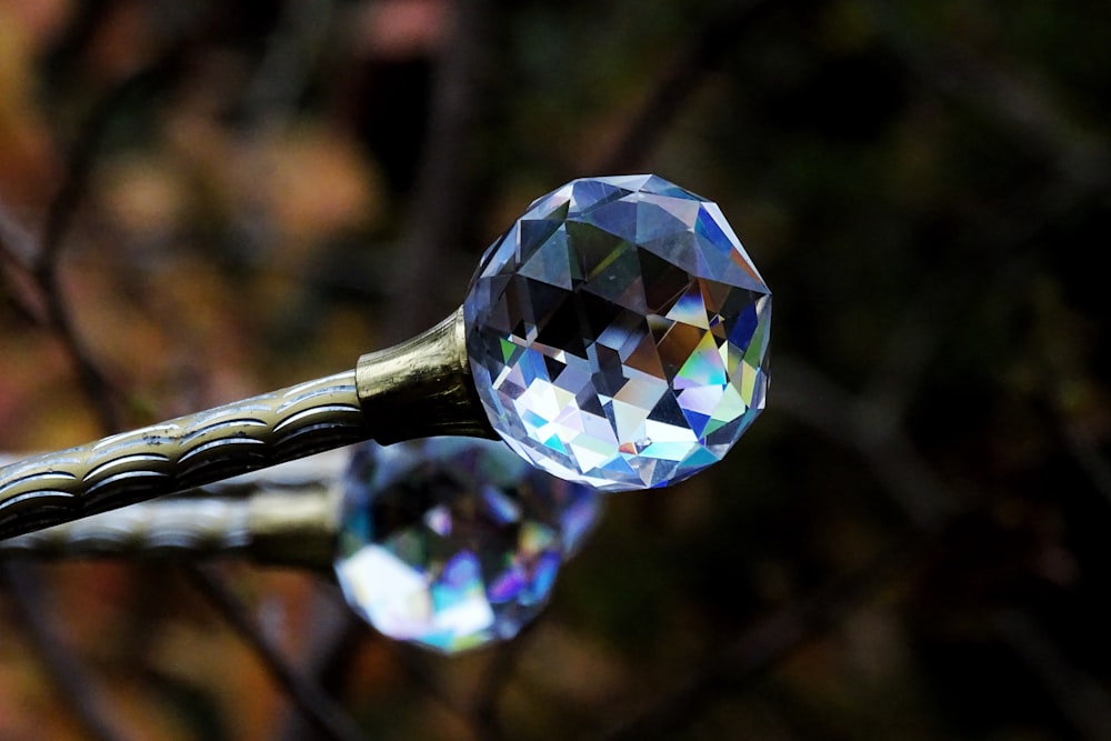 a close up of a crystal ball on a twig
