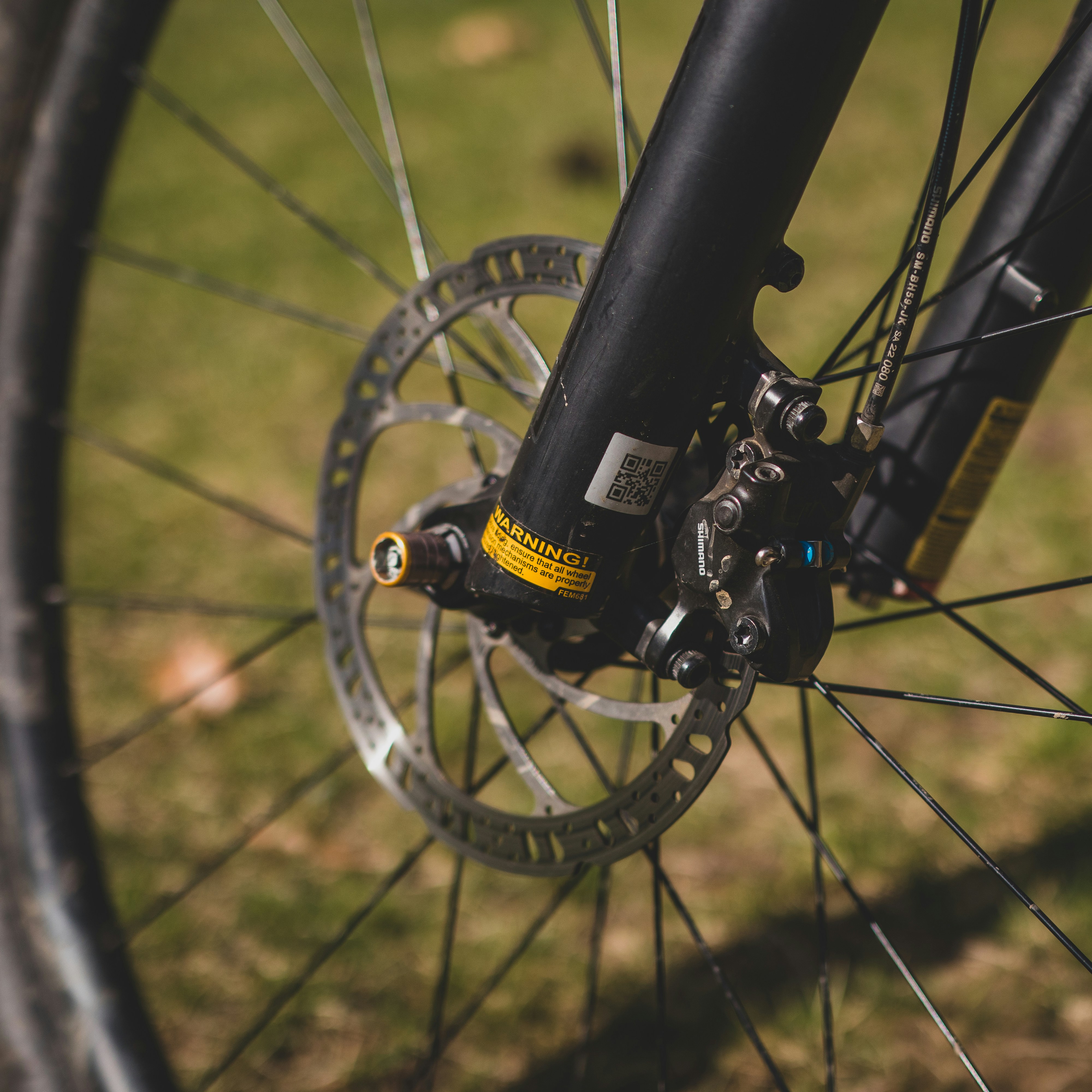 a close up of a bike tire and spokes