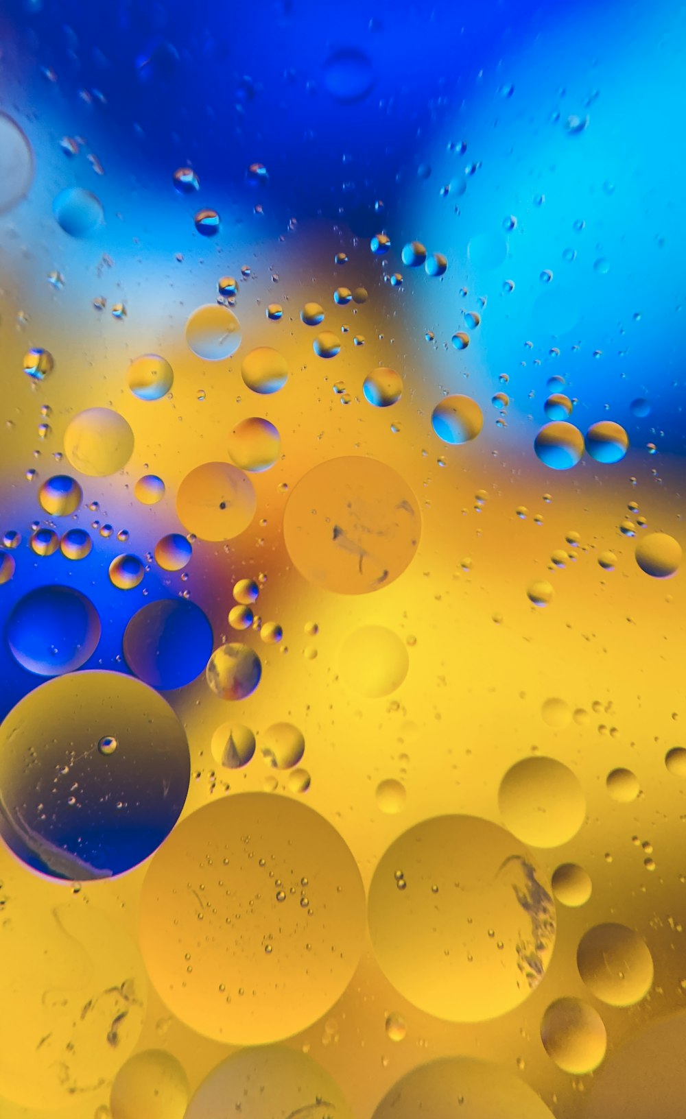 a close up of a blue and yellow liquid