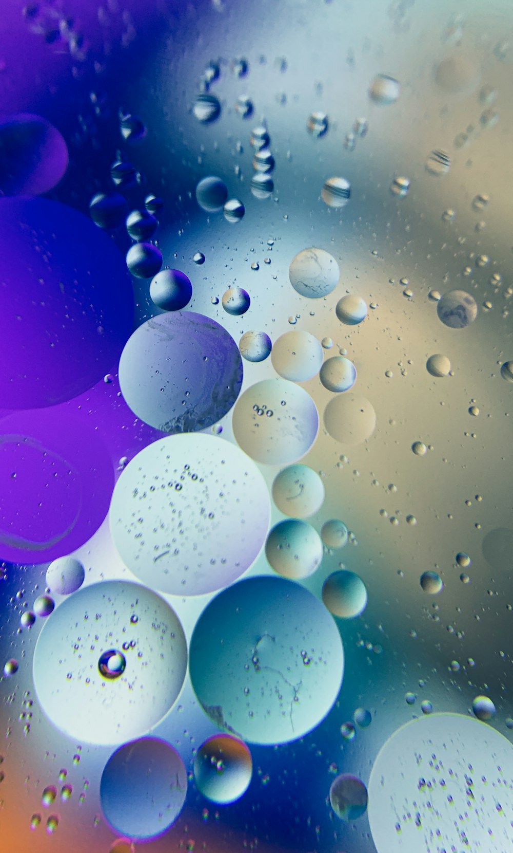 a close up of water droplets on a glass surface