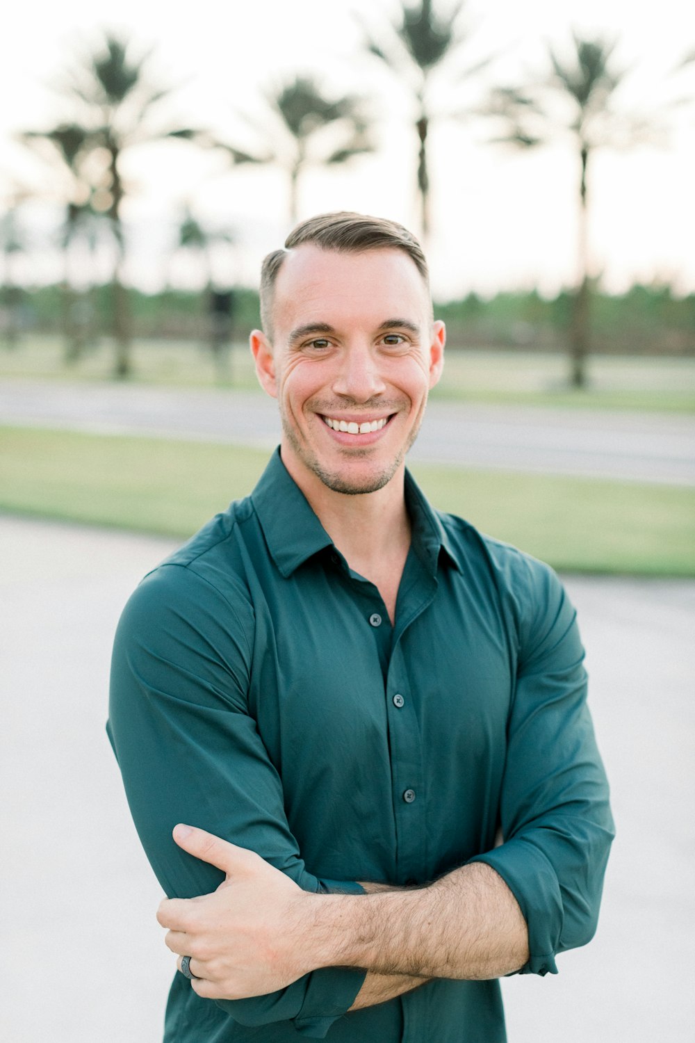 a man in a green shirt is posing for a picture