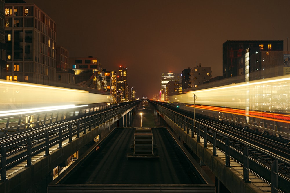 a train traveling through a city at night
