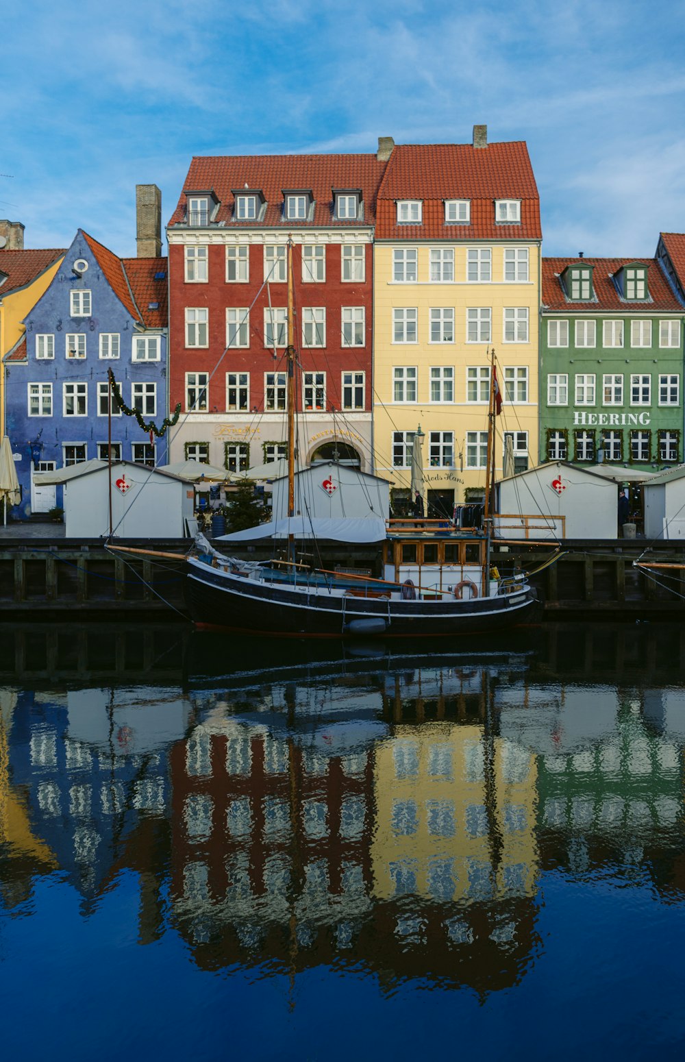 a row of buildings next to a body of water