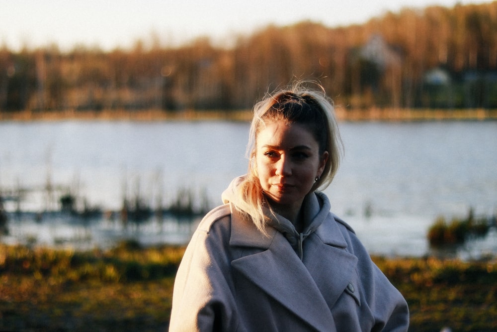 a person standing in front of a body of water