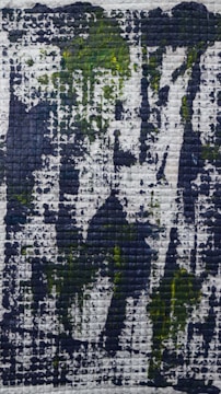 A close-up of a miniature oil painting grid with subtle color shifts.