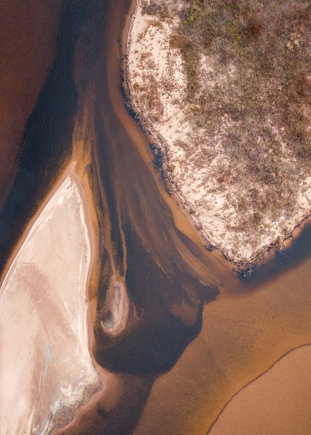 an aerial view of a body of water and land