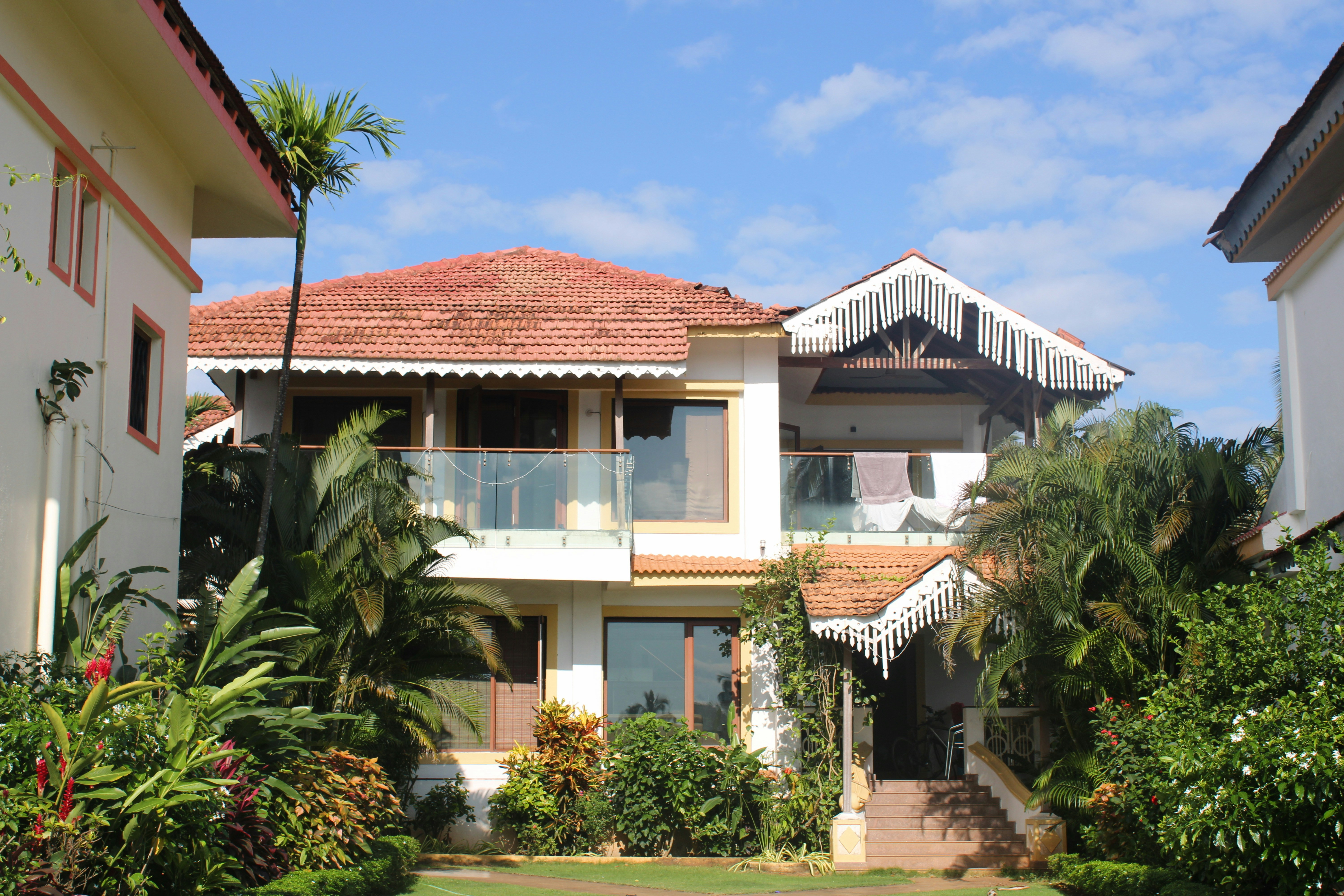 a large white house with a red roof