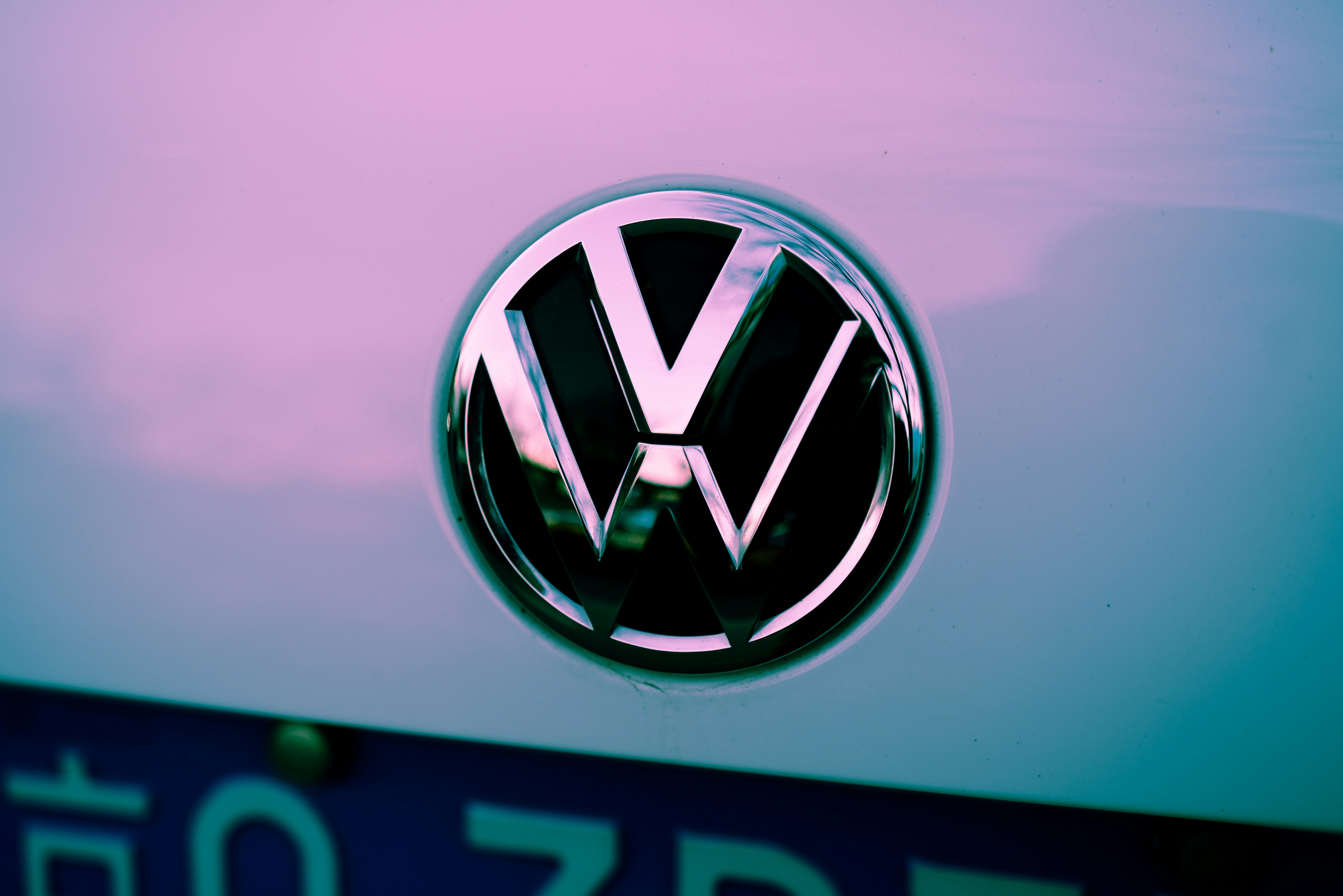 a vw emblem is shown on the front of a car
