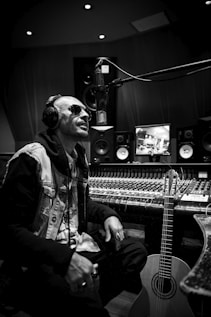 a man sitting in a recording studio with headphones on