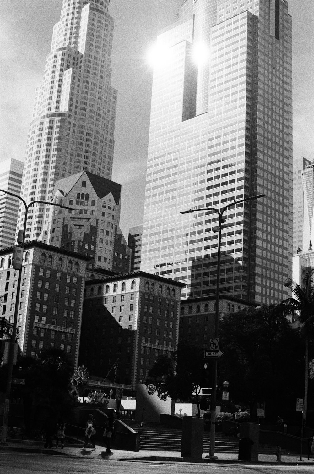 a black and white photo of tall buildings