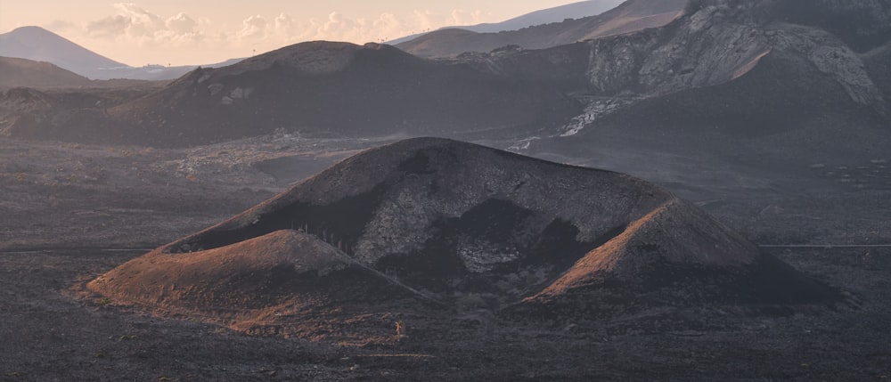 a mountain range with mountains in the background