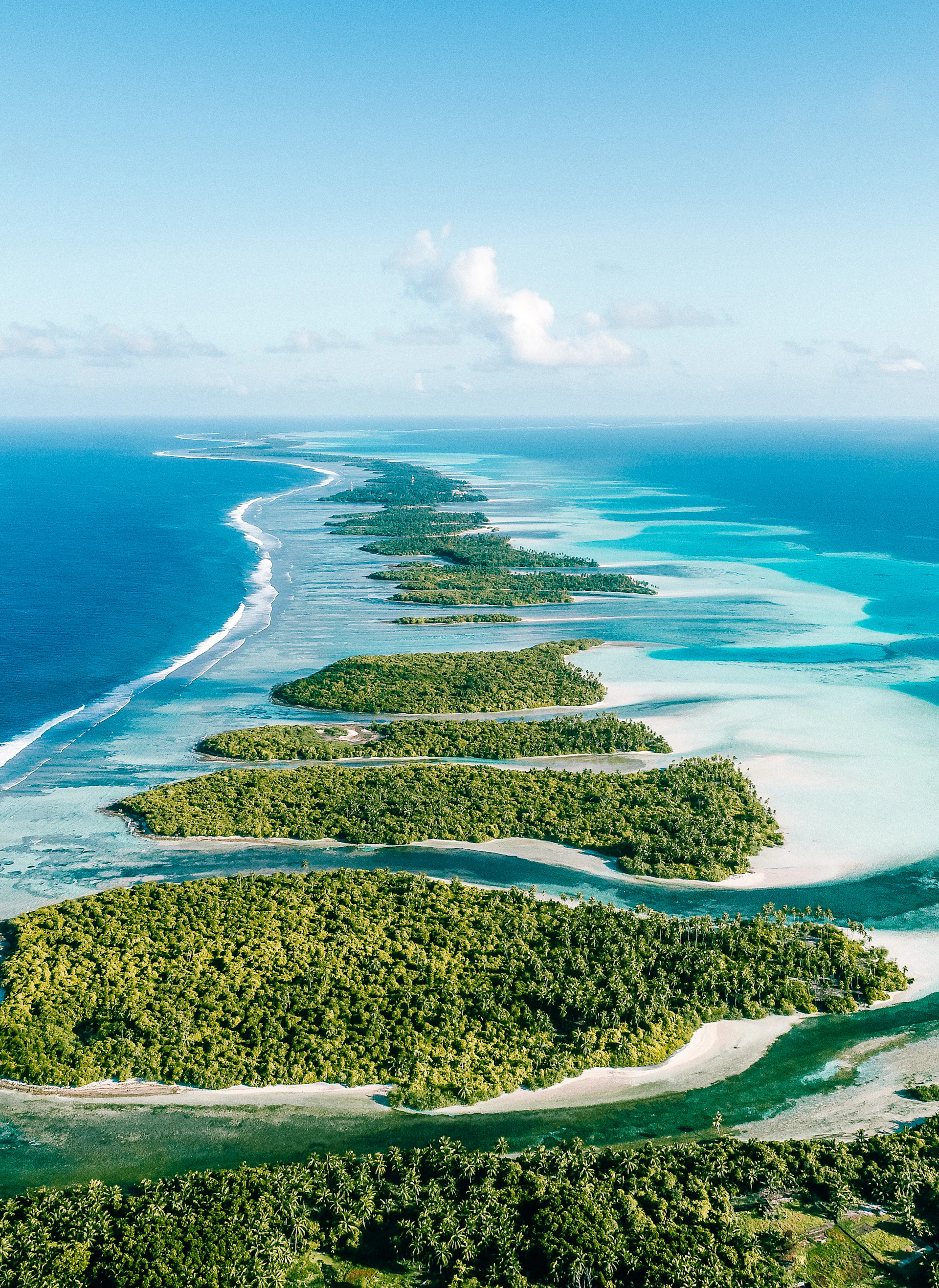 an aerial view of an island in the middle of the ocean