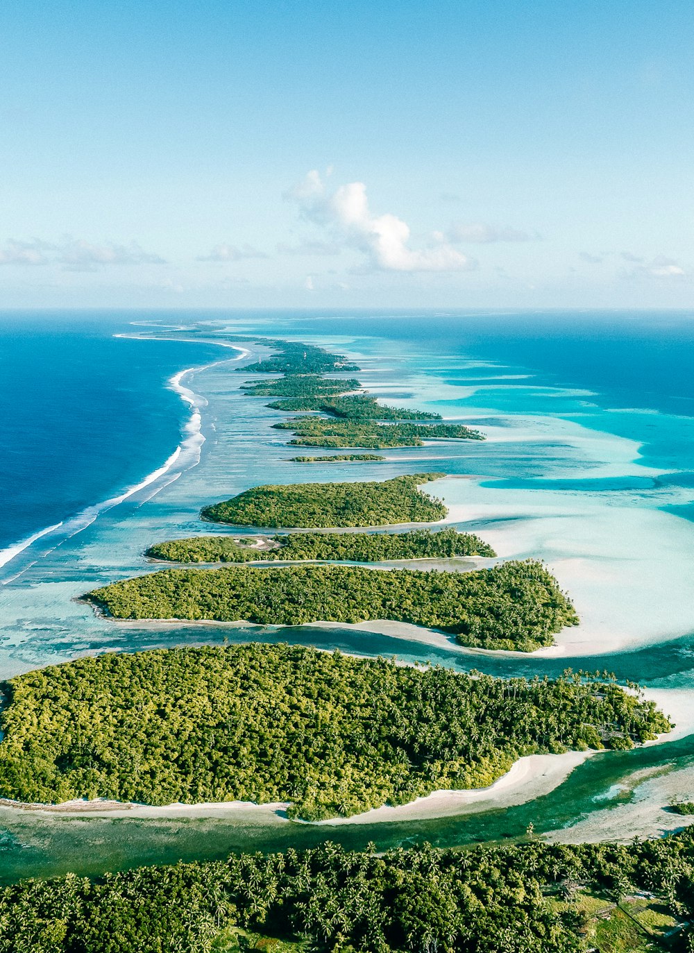 an aerial view of an island in the middle of the ocean