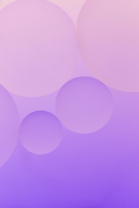 a close up of a cell phone on a purple background