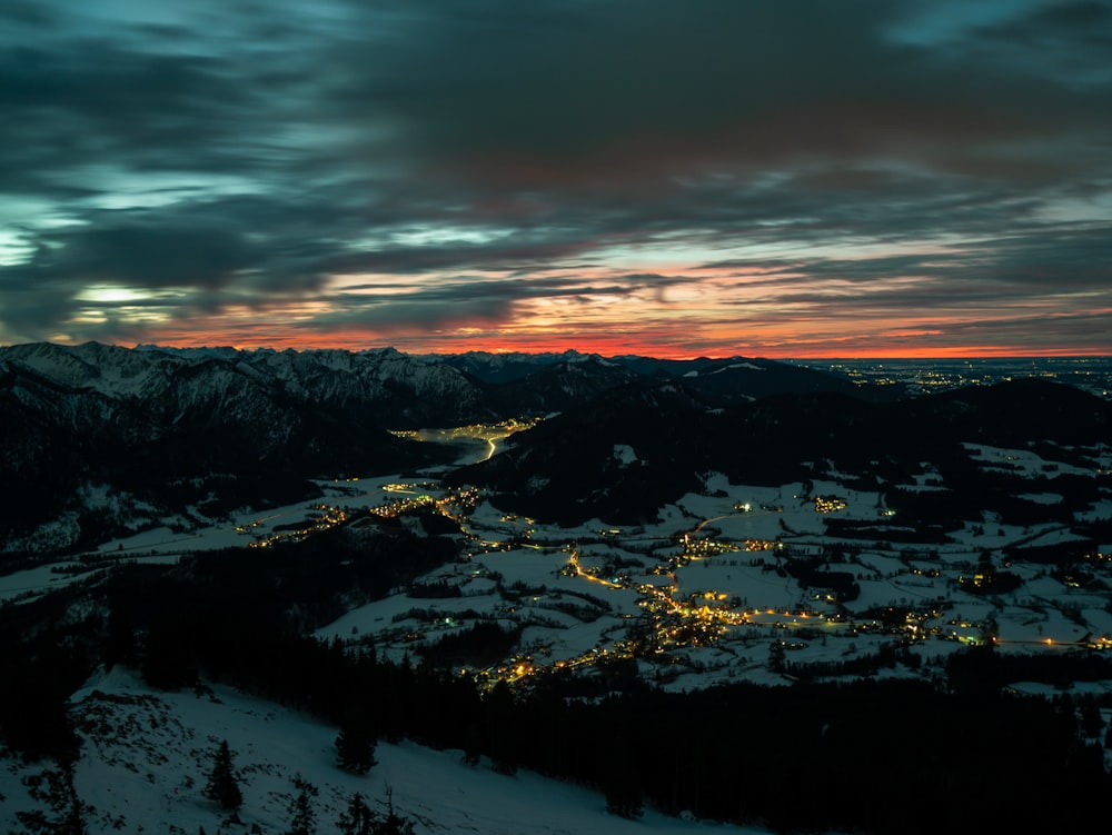 a night view of a snowy mountain range