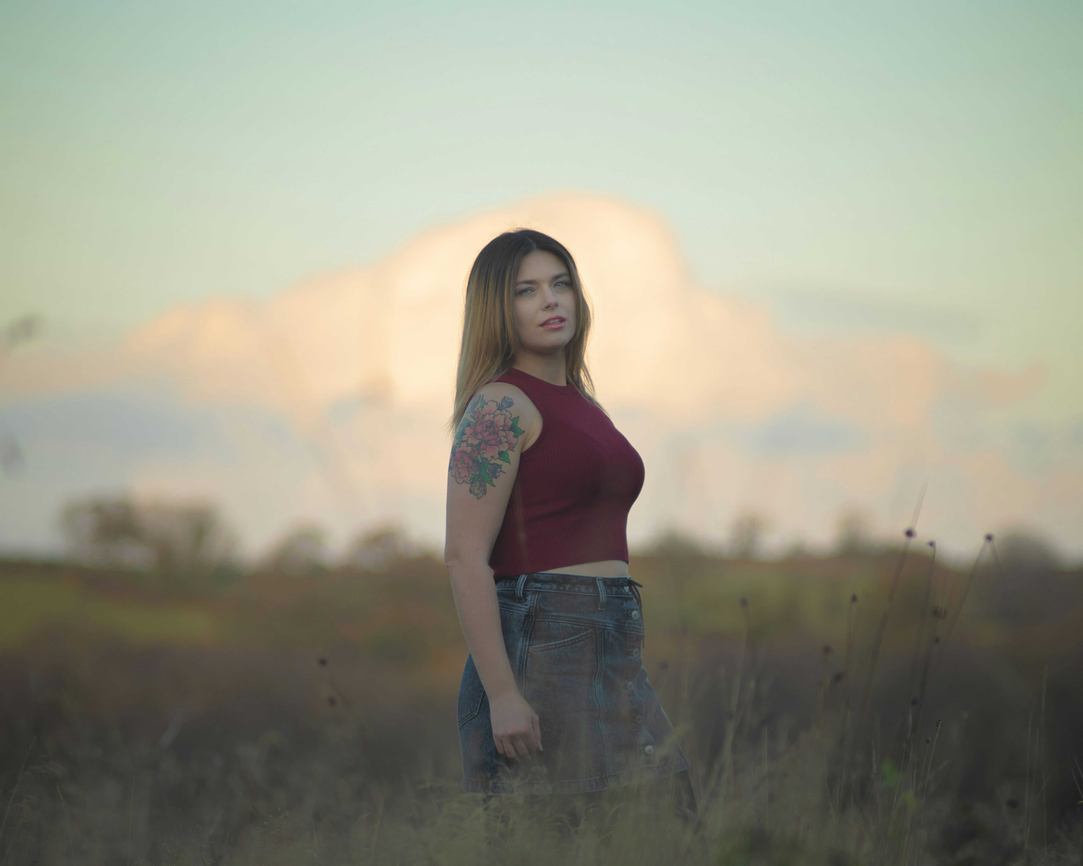 A woman standing in a field of tall grass photo – Free Photography ...