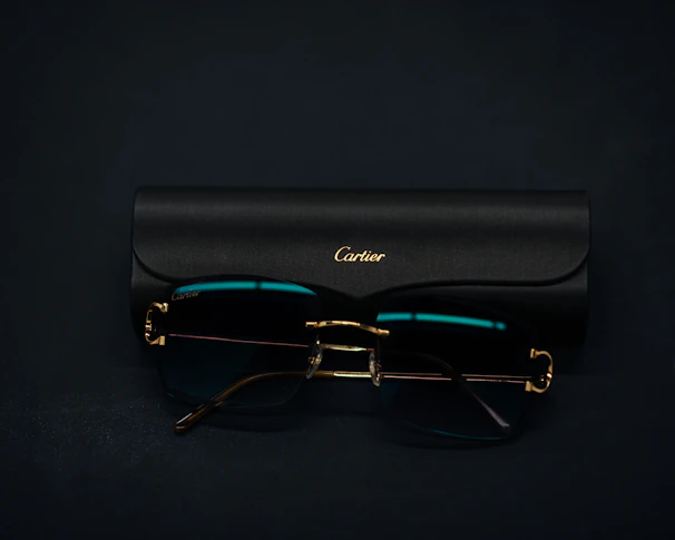 a pair of glasses sitting on top of a black case