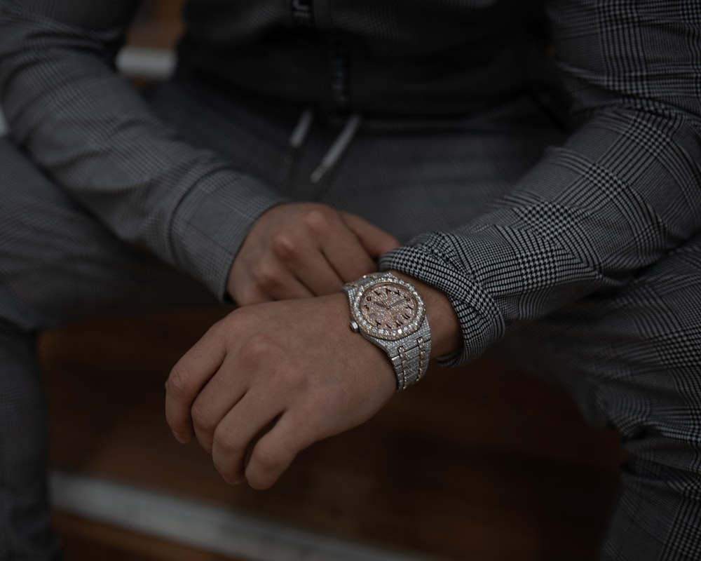 a close up of a person wearing a watch