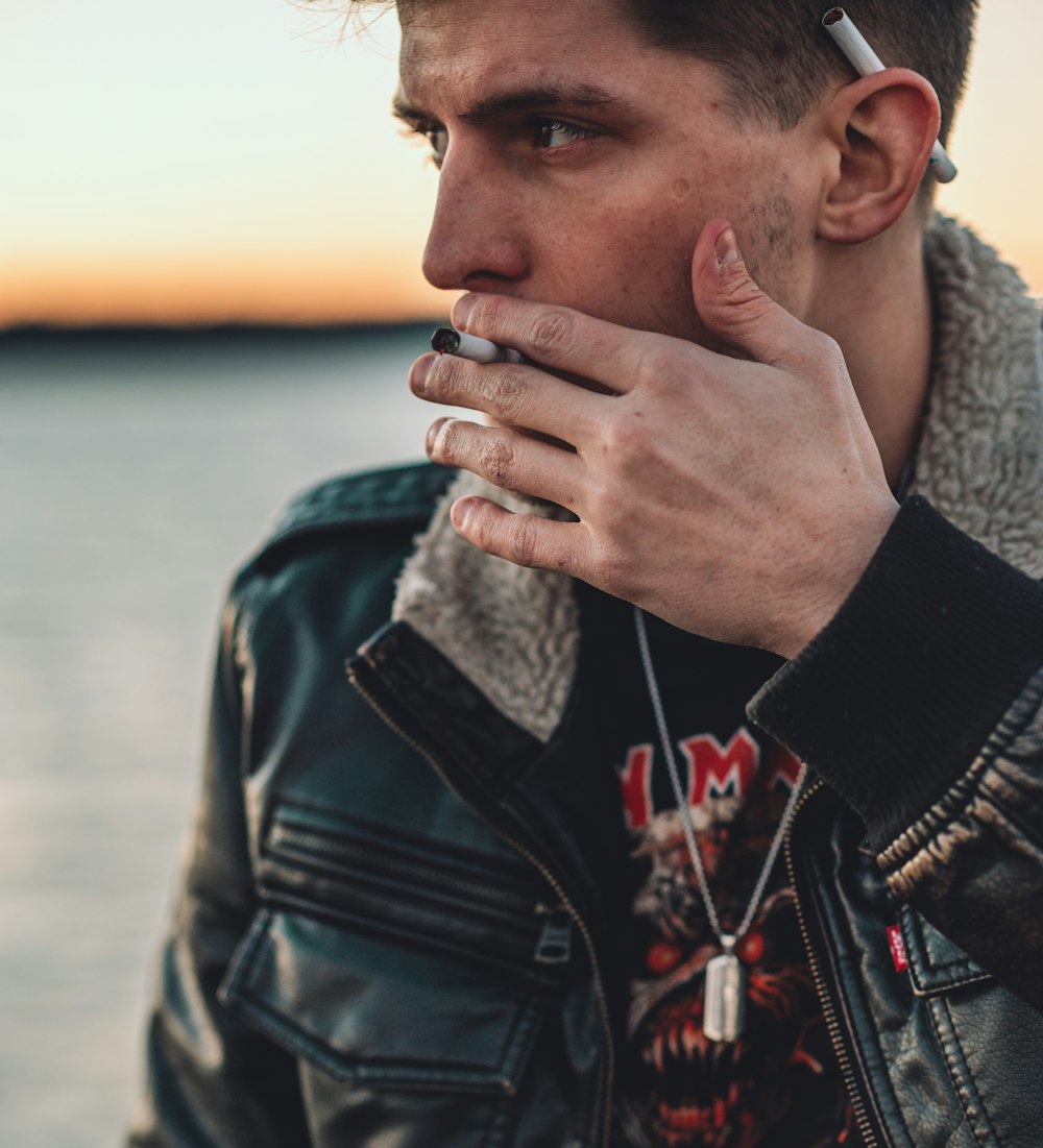 a man with a cigarette in his mouth