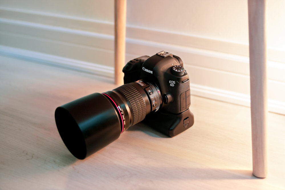 a camera sitting on top of a wooden table