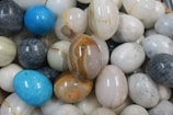 a bunch of marbles that are all different colors