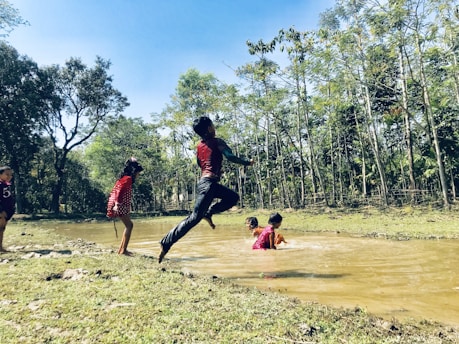 Children playing outdoors in a natural garden setting