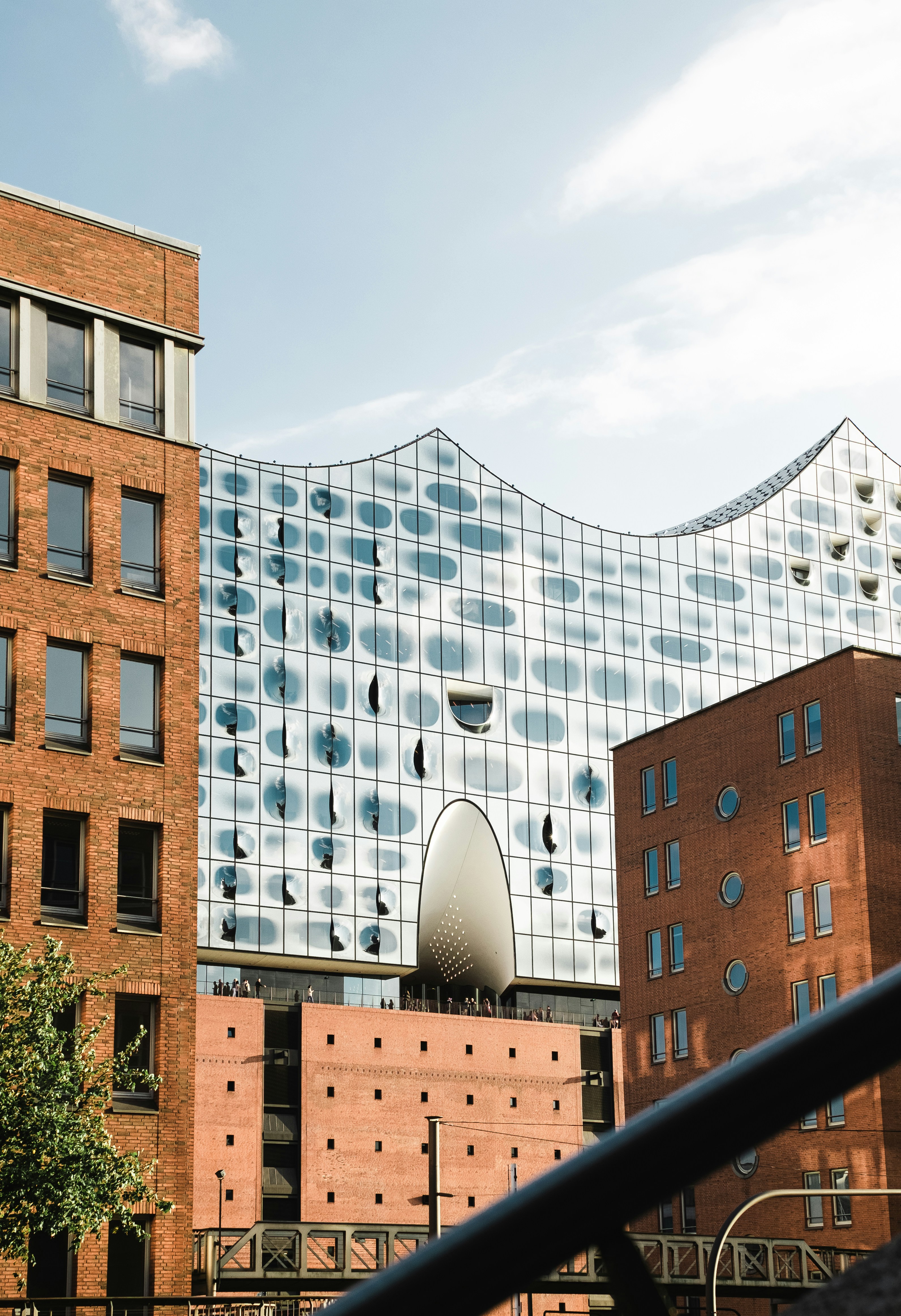 a tall building with a large mirror on it's side