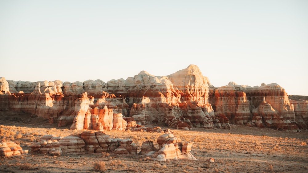 a rocky landscape with a mountain in the background