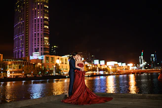 Elegant couple enjoying a sophisticated evening in a stylish urban setting.