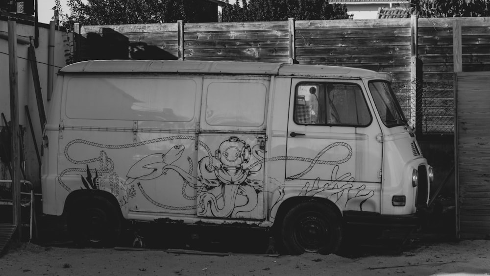 a white van with a drawing on the side of it