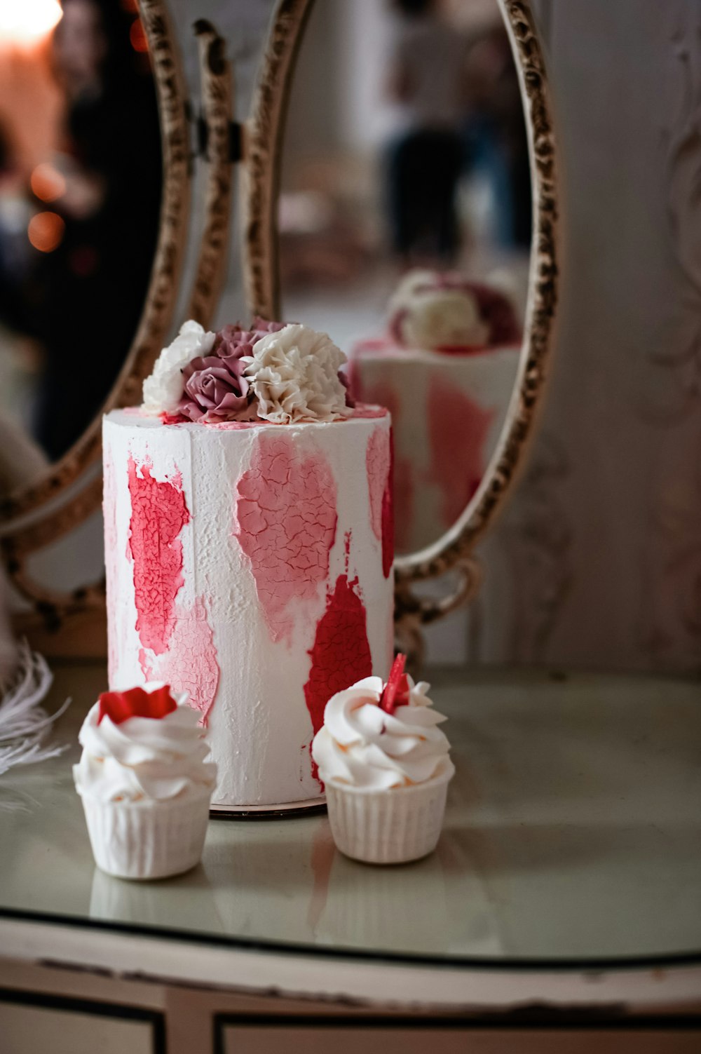 a red and white cake sitting on top of a table