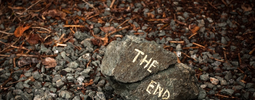 a rock with the word the end written on it