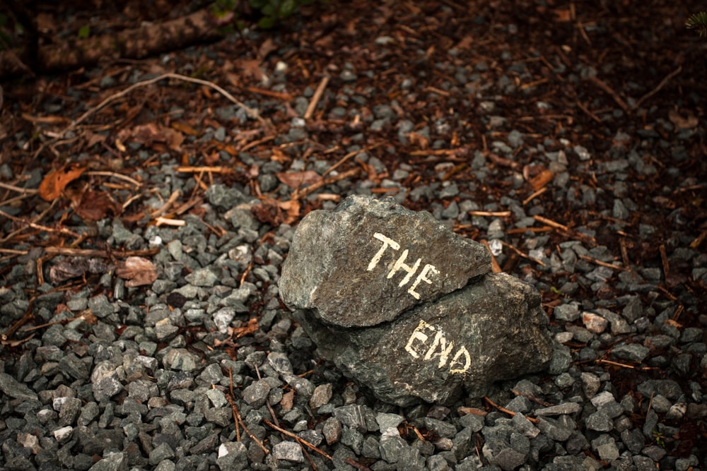 a rock with the word the end written on it