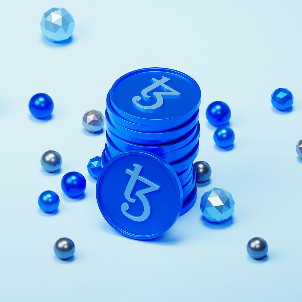 a stack of blue tokens sitting on top of a table