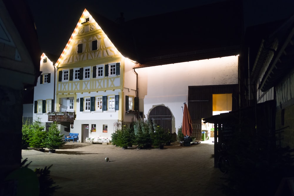 a large building with a lit up clock on it's side