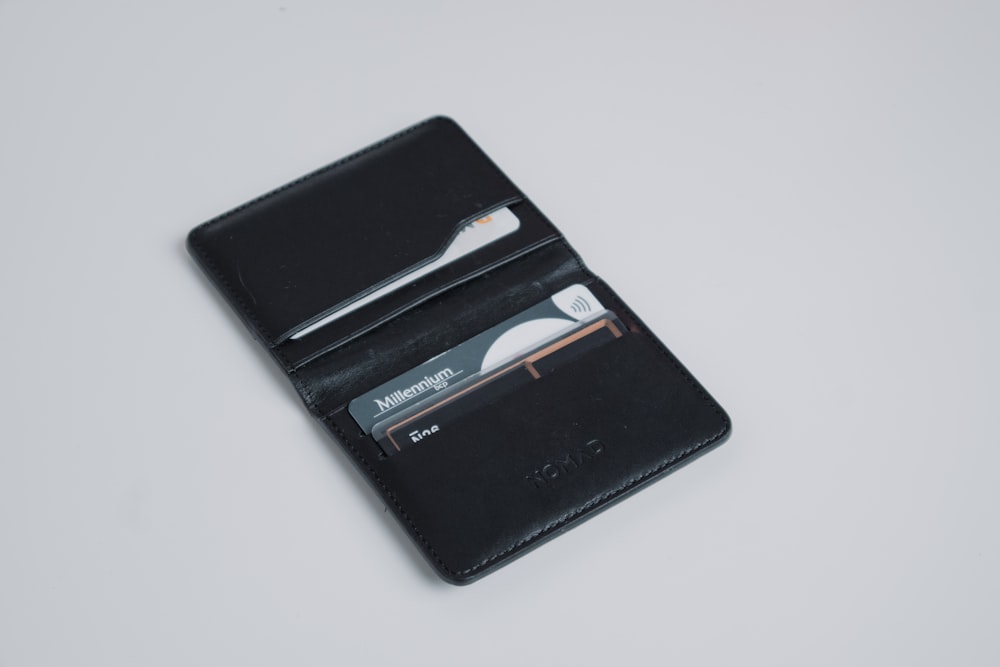 a black leather wallet with a credit card holder